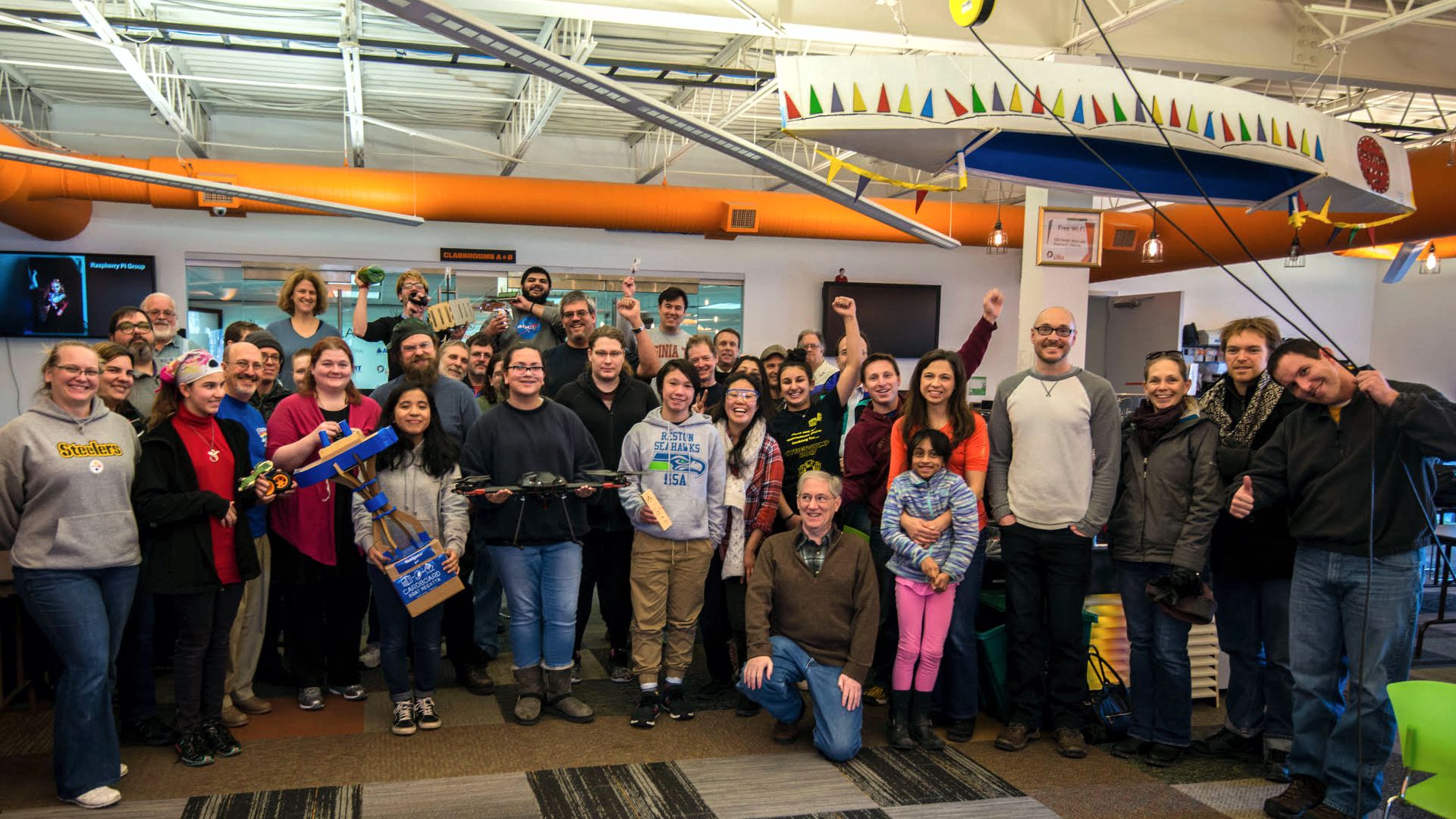 Group photo inside Nova Labs of members and their projects